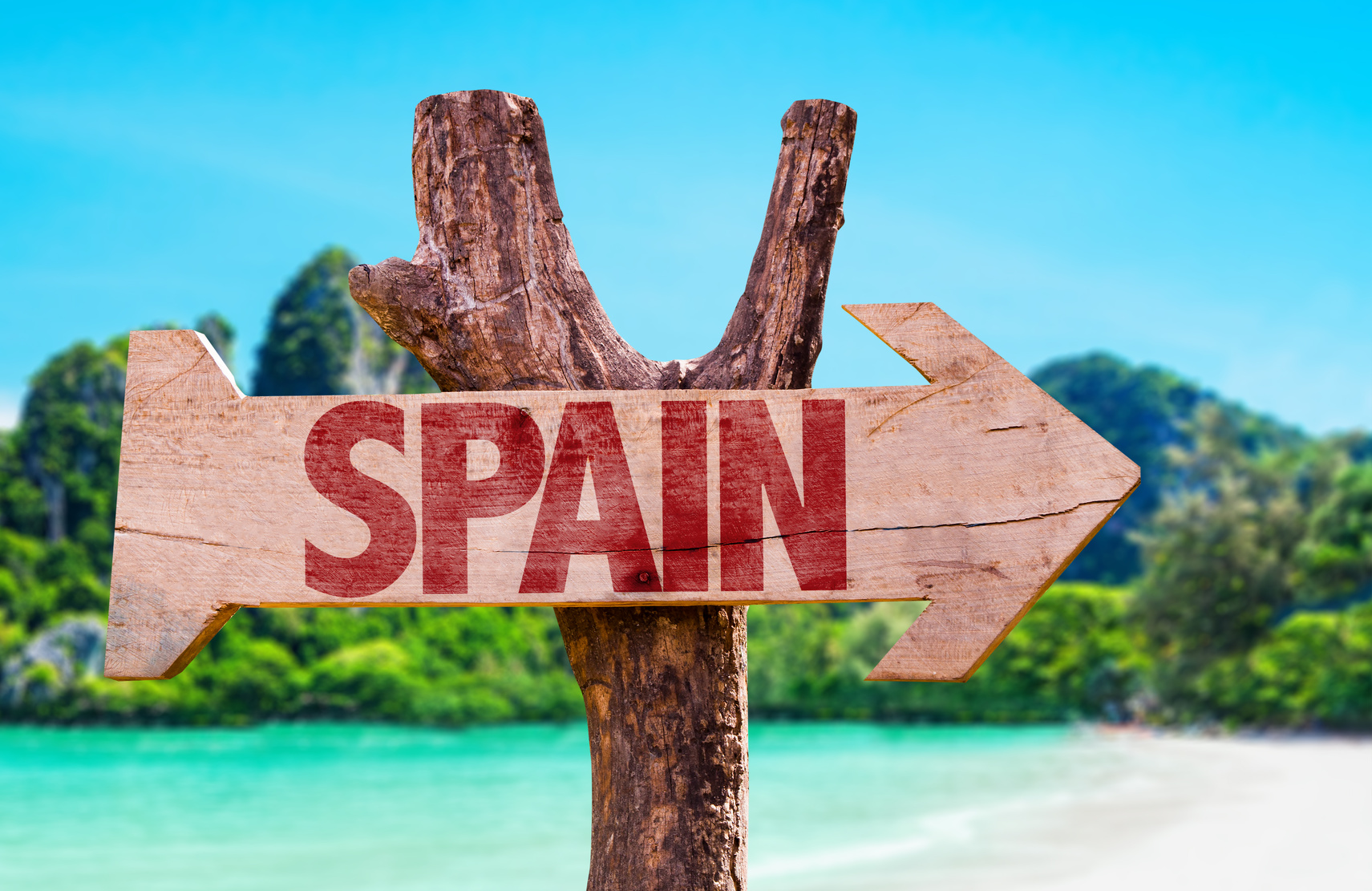 Spain wooden sign with beach background